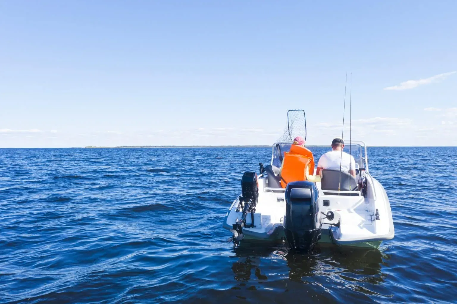 bigstock-Fisherman-On-Boat-At-The-Ocean-382043345-1-min-1536x1023.webp