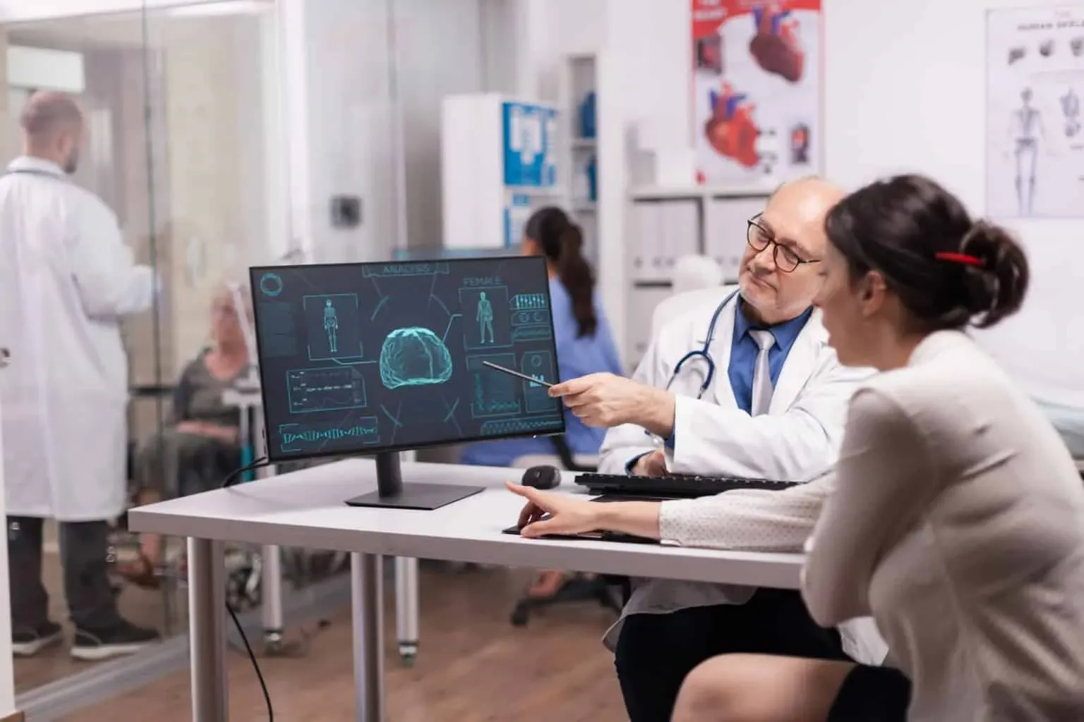 bigstock-Mature-Doctor-Explaning-X-ray-383518229-1-min-1536x1024.webp