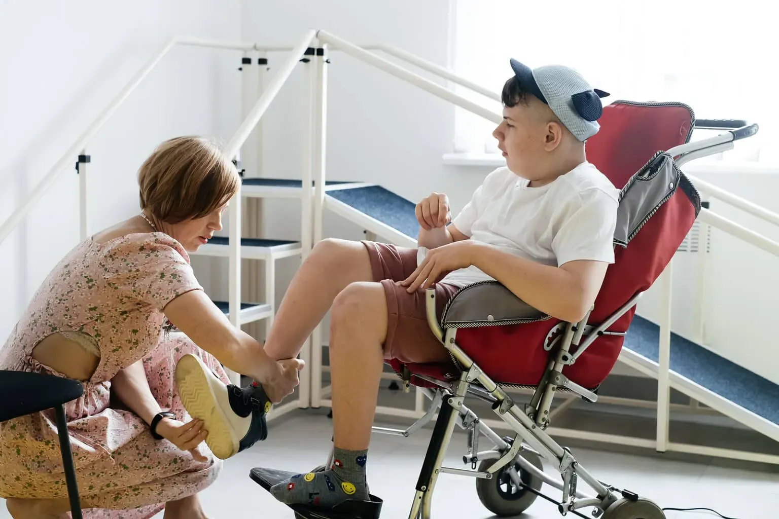 mother-helping-disabled-boy-1536x1024.webp